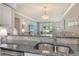 Kitchen featuring granite countertops, a stainless steel sink, and an open concept design at 9470 High Gate Dr # 2213, Sarasota, FL 34238