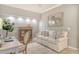 Cozy living room features neutral tones, tile flooring, and comfortable seating near an office area at 9470 High Gate Dr # 2213, Sarasota, FL 34238