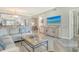Comfortable living room with updated décor and seamless access to the kitchen at 9470 High Gate Dr # 2213, Sarasota, FL 34238