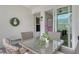 View of a covered patio with seating, decor, and access to the home at 9470 High Gate Dr # 2213, Sarasota, FL 34238