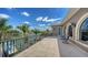Expansive balcony with waterway views, upscale railings, and comfortable seating area at 975 Whitakers Ln, Sarasota, FL 34236