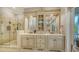 Spacious bathroom with walk-in shower, and vanities, and ample storage at 975 Whitakers Ln, Sarasota, FL 34236