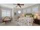 Bright bedroom featuring a round window and matching furnishings at 975 Whitakers Ln, Sarasota, FL 34236