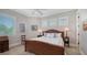 Comfortable bedroom featuring many windows with shutters, and natural light at 975 Whitakers Ln, Sarasota, FL 34236
