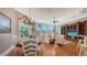 Open-concept dining and living space with bright, natural light at 975 Whitakers Ln, Sarasota, FL 34236