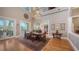 Elegant dining room with high ceilings, chandelier, and access to outdoor patio at 975 Whitakers Ln, Sarasota, FL 34236