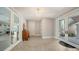 Bright entryway with tile floors, chandelier, and glass doors leading to living spaces at 975 Whitakers Ln, Sarasota, FL 34236