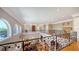 Second story indoor balcony overlooking main floor at 975 Whitakers Ln, Sarasota, FL 34236