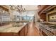 Gourmet kitchen with stainless appliances, granite countertops and island with backyard views at 975 Whitakers Ln, Sarasota, FL 34236