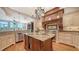 Spacious kitchen island featuring granite countertops, stainless steel appliances, and custom wood detailing at 975 Whitakers Ln, Sarasota, FL 34236
