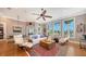 Bright living room with large windows offering beautiful views and comfortable seating at 975 Whitakers Ln, Sarasota, FL 34236