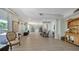 Spacious living room featuring hardwood floors, neutral tones, and ample natural light at 975 Whitakers Ln, Sarasota, FL 34236