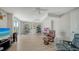 Open-concept living room boasting hardwood floors, bright light and versatile design at 975 Whitakers Ln, Sarasota, FL 34236
