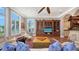 Cozy living area with a large bookcase and comfortable seating area at 975 Whitakers Ln, Sarasota, FL 34236