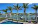 Backyard showcasing a beautiful pool and scenic waterfront with boats docked nearby at 975 Whitakers Ln, Sarasota, FL 34236