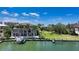 Waterfront property showcasing a private pool and dock with Gulf access at 975 Whitakers Ln, Sarasota, FL 34236