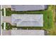 Aerial view of the house with its roof, landscaping, and driveway showcasing its overall layout and design at 10394 Abaco Falls Dr, Englewood, FL 34223