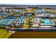 An aerial shot featuring the neighborhood amenities including tennis, pickleball, and a resort-style pool at 10394 Abaco Falls Dr, Englewood, FL 34223
