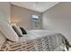 Comfortable bedroom featuring a ceiling fan and a window with natural light streaming in at 10394 Abaco Falls Dr, Englewood, FL 34223
