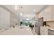 Open concept living space with a view of the island into the living room at 10394 Abaco Falls Dr, Englewood, FL 34223