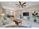 Bright and airy living room with an open floor plan, perfect for entertaining guests at 10394 Abaco Falls Dr, Englewood, FL 34223