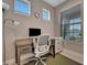 Close up of an office space featuring a desk, computer and a rolling chair at 10394 Abaco Falls Dr, Englewood, FL 34223