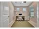 Well-lit office space with a comfortable desk and chair, natural lighting, and neutral tones at 10394 Abaco Falls Dr, Englewood, FL 34223