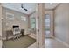 Bright office space with a desk, comfortable chair, and natural light from two windows at 10394 Abaco Falls Dr, Englewood, FL 34223