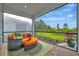Relaxing outdoor patio with comfortable seating and lush green views, ideal for lounging and unwinding at 10394 Abaco Falls Dr, Englewood, FL 34223