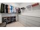 Spacious walk-in closet with organized shelving, drawers, and ample storage at 10394 Abaco Falls Dr, Englewood, FL 34223