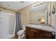 Well-lit bathroom featuring a shower, single sink vanity, and neutral tones at 1122 42Nd E Ter, Bradenton, FL 34208