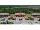 Expansive aerial view of a condo complex, lush landscaping, and ample parking, offering a serene and community-rich environment at 12409 Osorio Ct # 102, Sarasota, FL 34238