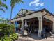 Inviting outdoor bar area with casual seating and a Bahama Bar sign at 12409 Osorio Ct # 102, Sarasota, FL 34238