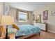 Bright and airy bedroom with a dresser, window, and neutral wall color at 12409 Osorio Ct # 102, Sarasota, FL 34238