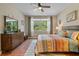 Serene bedroom with a large window, comfortable bed, and ample natural light at 12409 Osorio Ct # 102, Sarasota, FL 34238