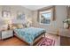Cozy bedroom with a decorative rug, natural lighting, and a window at 12409 Osorio Ct # 102, Sarasota, FL 34238