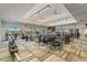 Bright fitness center featuring treadmills, weight machines, ceiling fans and large mirrors for a complete workout at 12409 Osorio Ct # 102, Sarasota, FL 34238