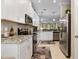 Well-equipped kitchen with stainless steel appliances, granite countertops, and white cabinetry at 12409 Osorio Ct # 102, Sarasota, FL 34238