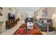 Spacious living room boasts a colorful rug, modern furnishings, and an open layout for entertaining at 12409 Osorio Ct # 102, Sarasota, FL 34238