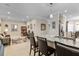 Open-concept living space connecting the kitchen, office, and dining area in a cohesive design at 12409 Osorio Ct # 102, Sarasota, FL 34238