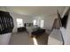 Contemporary main bedroom with modern decor, soft carpet, and plenty of natural light at 13016 Cedar Elm Lane, Parrish, FL 34219