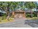 Charming home with mature trees, a two-car garage, and a neatly landscaped front yard at 1308 Willow Oak Cir, Bradenton, FL 34209