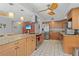 Open kitchen with granite countertops, stainless steel appliances, and a large island with seating at 1308 Willow Oak Cir, Bradenton, FL 34209