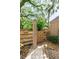 An outdoor shower area with stone pavers and a wooden fence surround for convenient rinsing after a swim at 1308 Willow Oak Cir, Bradenton, FL 34209
