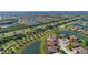 Expansive aerial view of a residential community with winding roads, lakes, and lush landscaping at 13587 Vancanza Dr, Venice, FL 34293