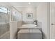 Bright bathroom with a glass-enclosed shower and a relaxing soaking tub with tiled surround at 13587 Vancanza Dr, Venice, FL 34293