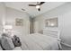 Inviting bedroom with a comfortable bed and a view of the closet and bathroom at 13587 Vancanza Dr, Venice, FL 34293