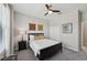 Bright bedroom with a ceiling fan, large window, and modern furnishings at 13587 Vancanza Dr, Venice, FL 34293