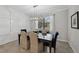 Dining room featuring a modern light fixture and plenty of natural lighting from the window at 13587 Vancanza Dr, Venice, FL 34293
