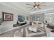 Cozy living room with neutral decor, modern accents, and ample seating for Gathering and guests at 13587 Vancanza Dr, Venice, FL 34293